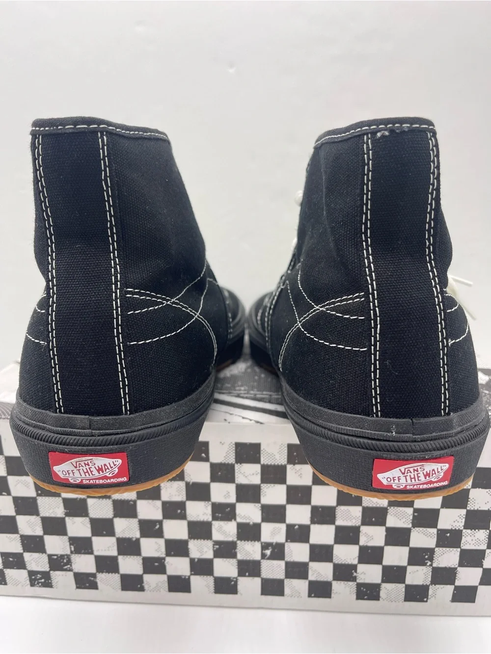 Vans Men’s High-Top Canvas Sneakers in Black and White